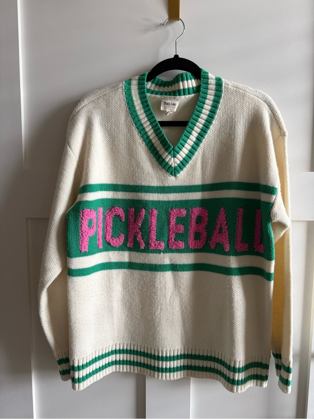 Peach Love California Cream V‑Neck Sweater with Green Stripes & Pink Lettering